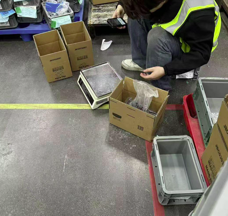 Warehouse staff packing orders for dropshipping
